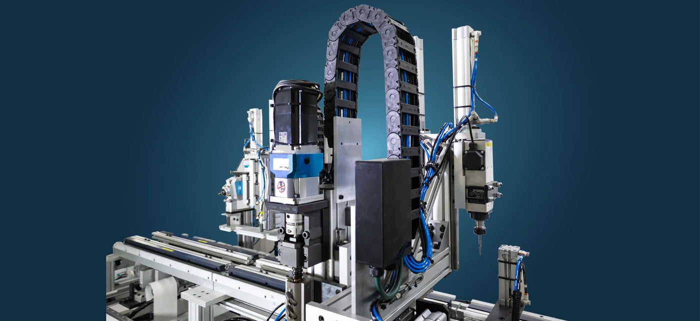 Complex festo cylinders forming a mechanical device with various components on a blue background